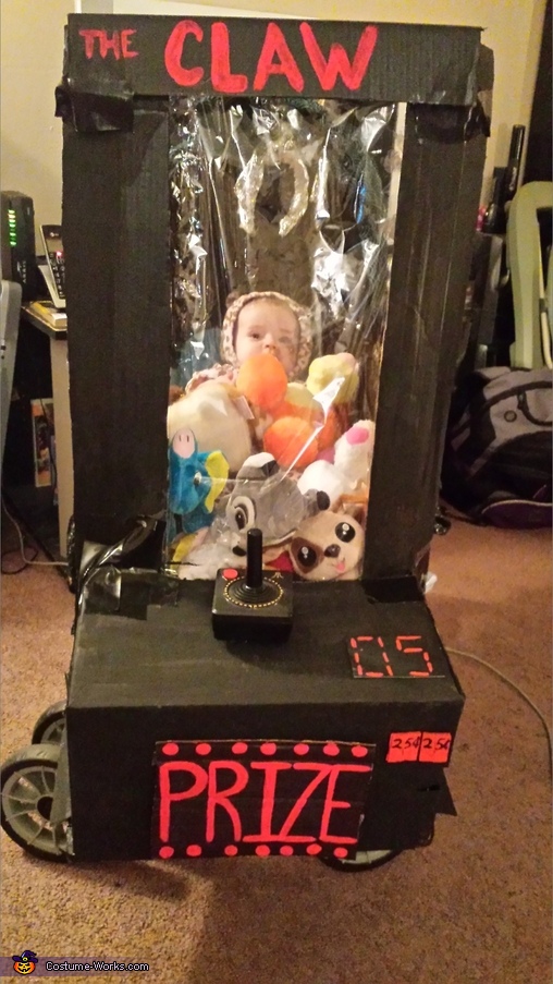 Baby stuck in Arcade Game Costume