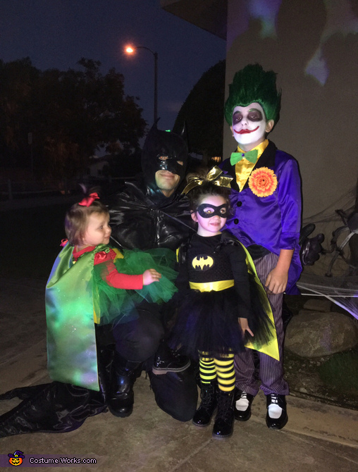Batman with his baby Joker, Batgirl and the Joker Costume