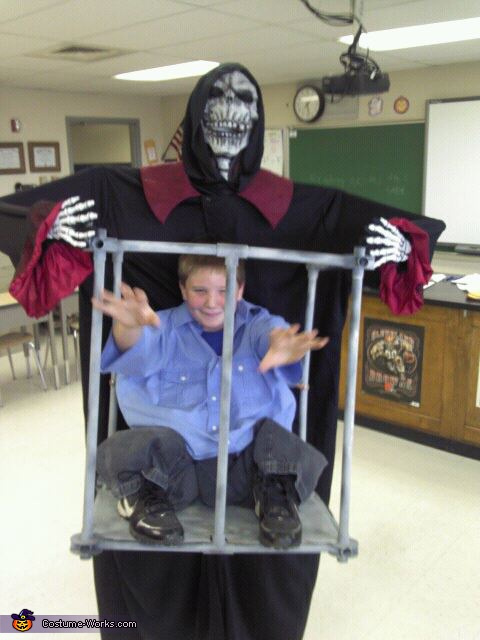 Boy Trapped in a Cage by Monster Costume