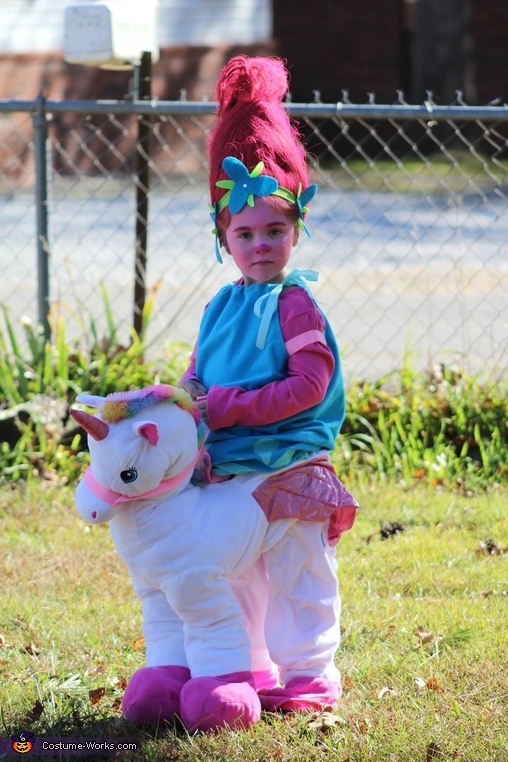 Poppy riding a Unicorn Costume