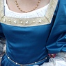Photo #3 - The pearls and trim are handsewn. 