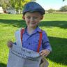 Photo #2 - Mason (King of New York) sharing news about the Newsies strike of 1899.