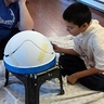 Photo #5 - Xavier paints the rim and the stencils